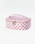 A pink zippered makeup bag with black polka dots, featuring a top handle and silver heart-shaped zipper pulls, set against a plain white background.